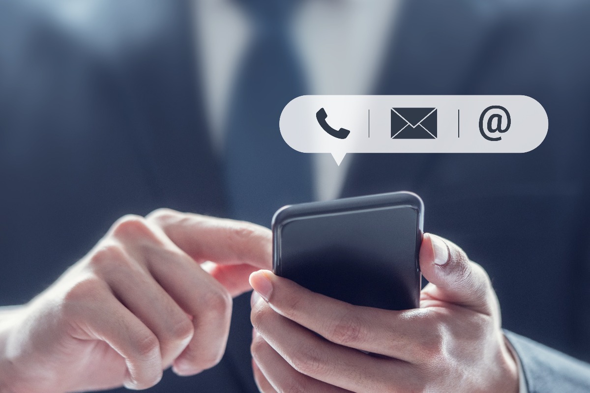 CONTACT US, Hand of Businessman holding mobile smartphone with ( mail,phone,email ) icon. customer support concept, copy space.